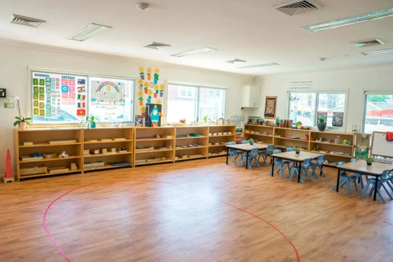 Spacious Montessori classroom at Condell Park Montessori Academy with learning shelves and activity tables