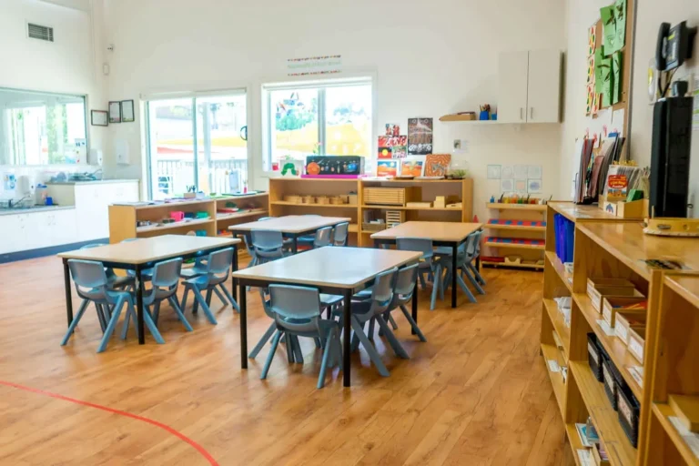 Montessori classroom at Condell Park Montessori Academy with activity tables and learning shelves