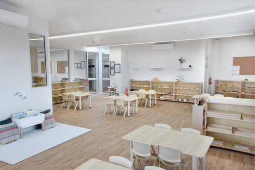 Toddler classroom at Elsternwick Montessori Academy featuring open learning spaces and Montessori resources.