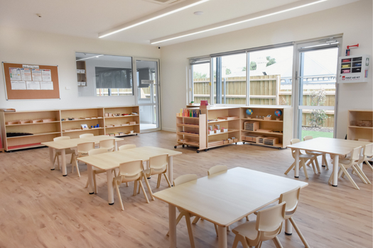 Montessori classroom at Elsternwick Montessori Academy with natural timber furniture and accessible learning materials.