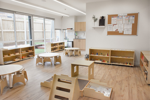 Infant classroom at Elsternwick Montessori Academy featuring Montessori materials and child-sized furniture.