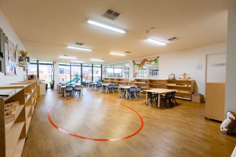Spacious Montessori classroom at Entrada Parramatta childcare centre with activity tables and open learning areas