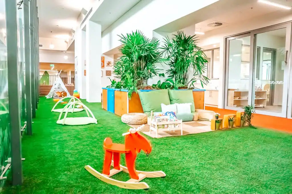 Gungahlin Childcare infant area with cushions and climbing equipment