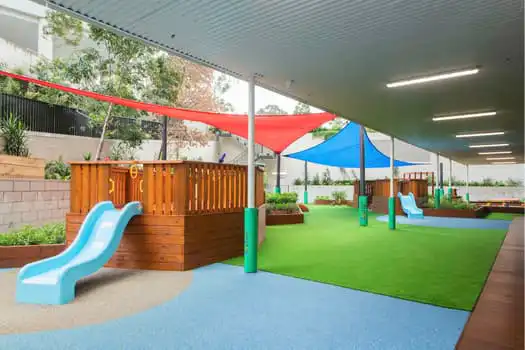 Covered outdoor playground at Midtown MacPark Montessori Academy childcare