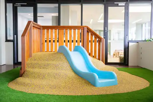 Covered outdoor climbing mound at Midtown MacPark Montessori Academy childcare