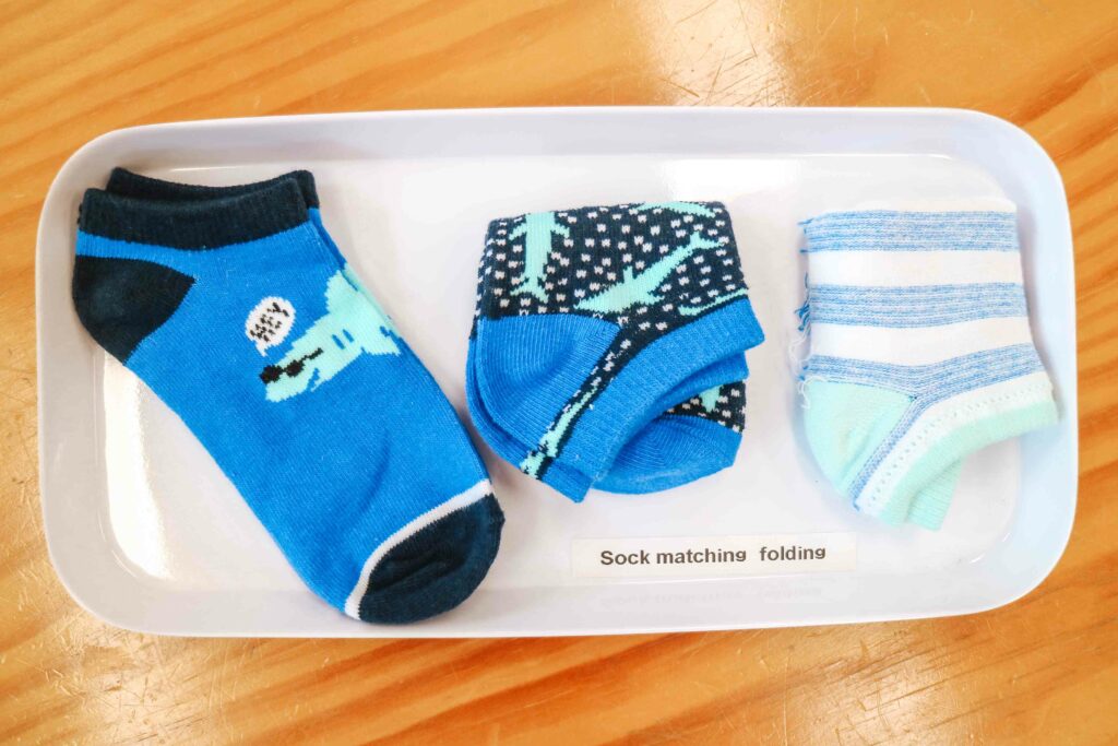 Montessori-Inspired Folding And Matching Socks Activity