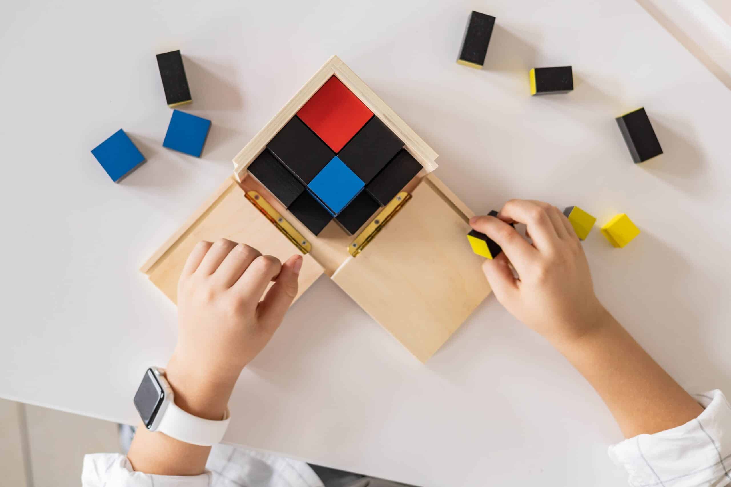 Child playing with wooden block puzzle 
