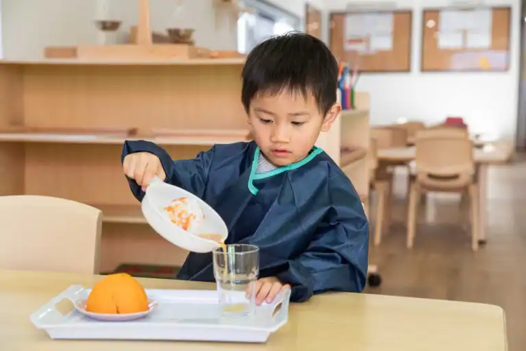 Child completing practical life activity at Toongabbie Metella Road Montessori Academy