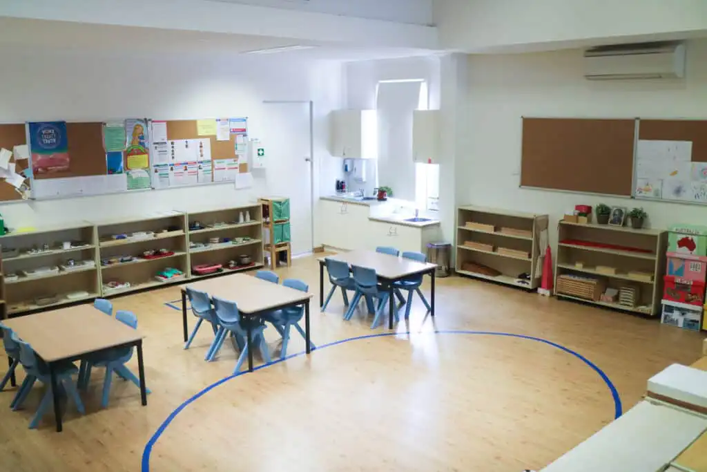 Montessori classroom at North Parramatta Montessori Academy with activity tables and learning shelves