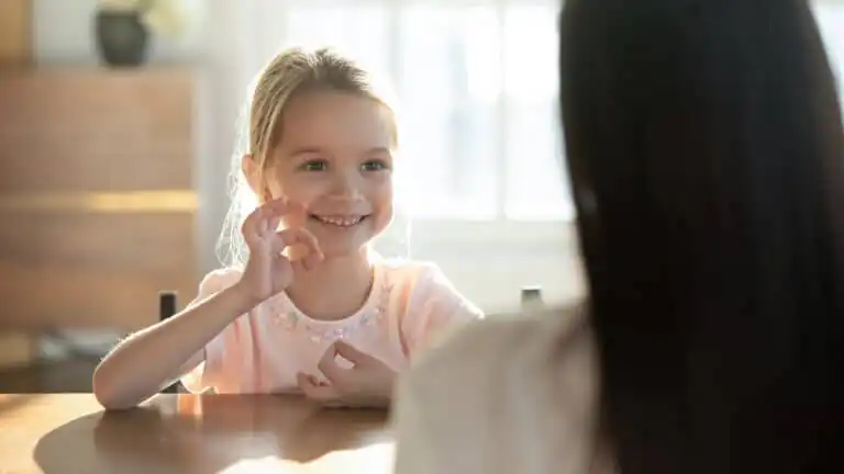 Child holding up hand