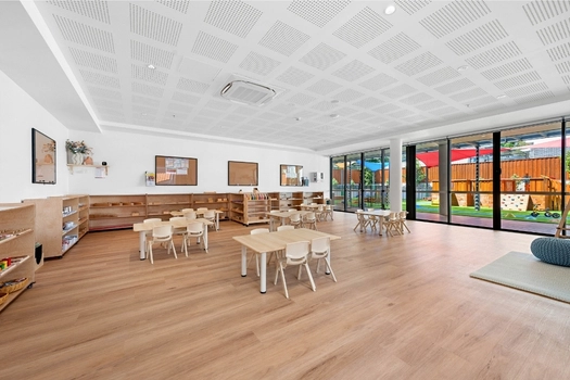 Bright Montessori classroom at Penrith Derby Street Montessori Academy with outdoor views and learning shelves