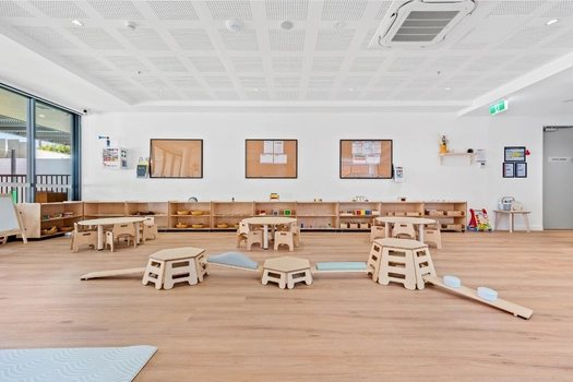 Montessori classroom at Penrith Derby Street Montessori Academy with learning shelves and activity areas