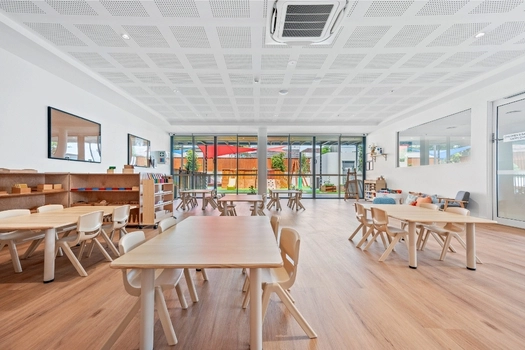 Bright Montessori classroom at Penrith Derby Street Montessori Academy with activity tables and learning shelves