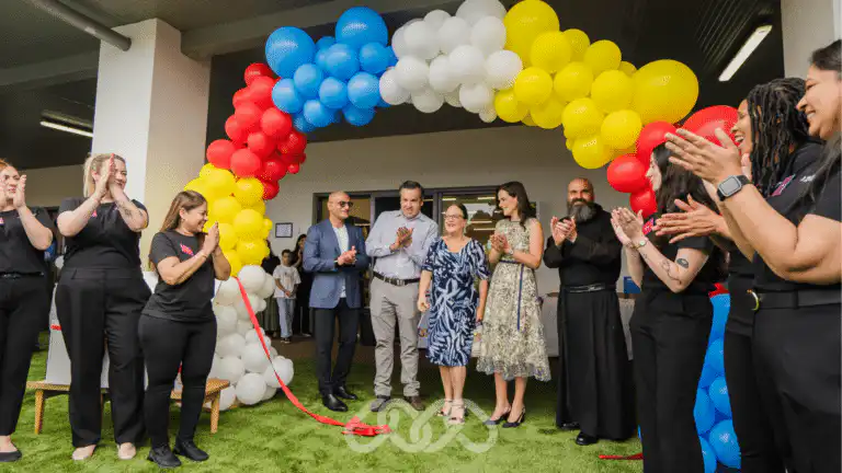 Official ribbon cutting ceremony at the Gregory Hills Childcare Grand Opening with community leaders and Montessori Academy team members.