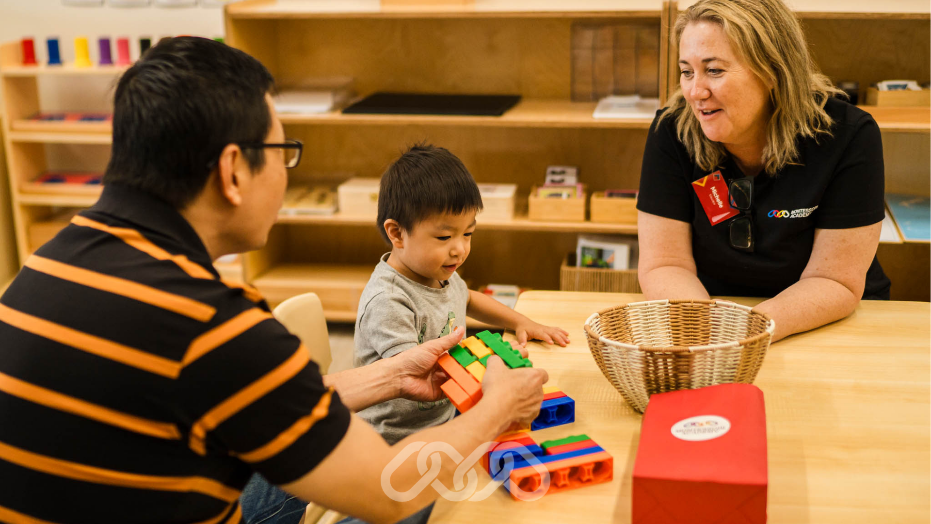 Child engaging in sensory activity during the Gregory Hills Childcare Grand Opening event.