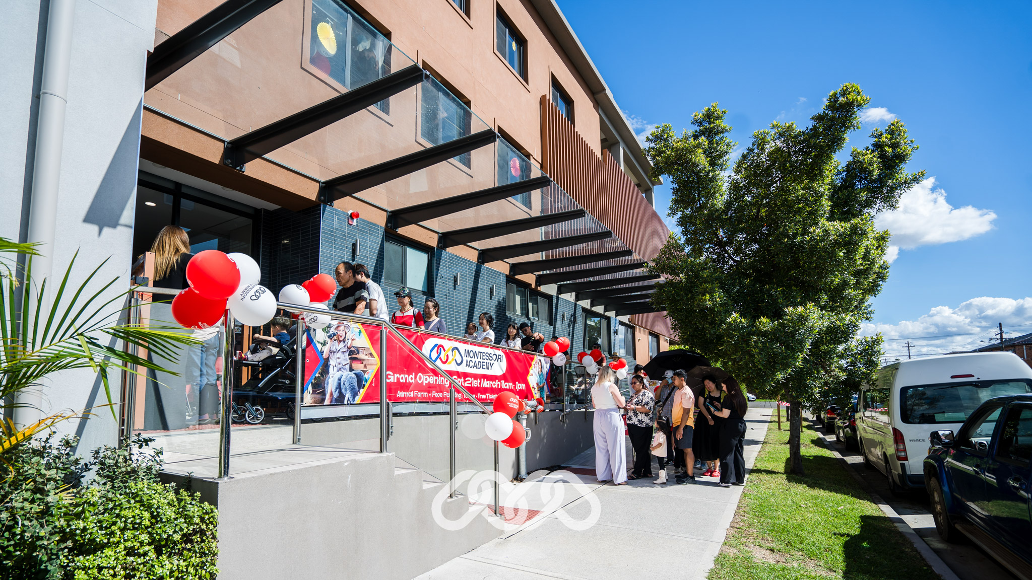 Families waiting to enter the Campsie Montessori Academy grand opening event