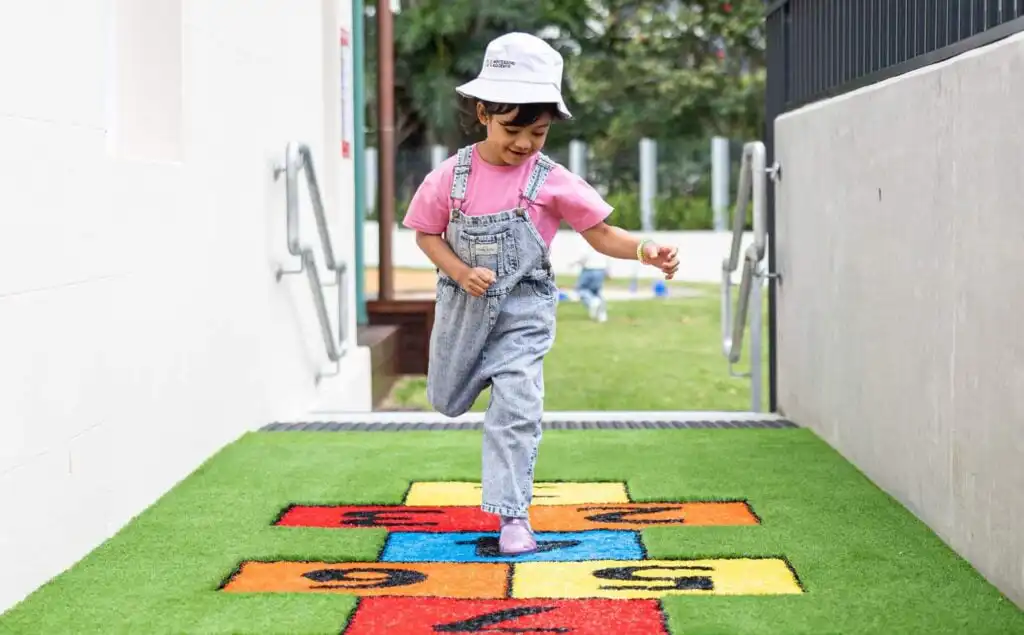 Montessori preschool child engaging in outdoor play at Montessori early learning centre in Sydney