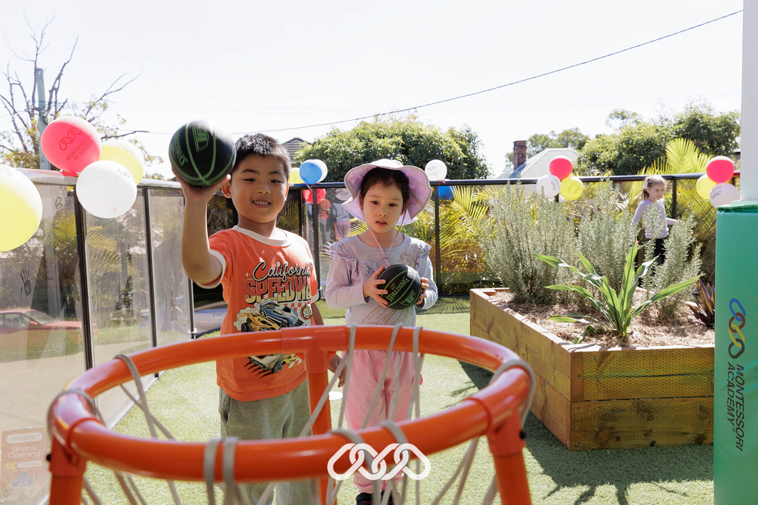 Children plays with child-size basket ball and net at Hurstville grand opening event