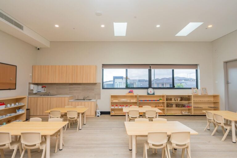 Leppington Montessori classroom with child-sized tables, learning shelves and activity areas