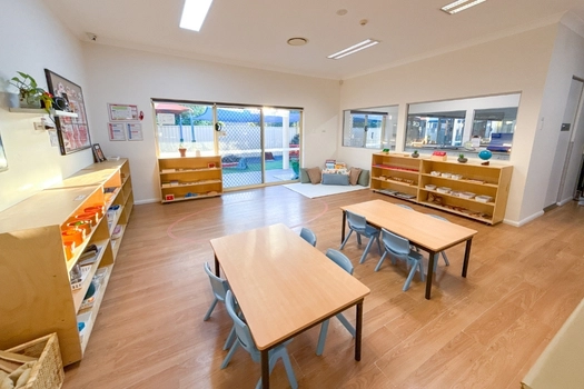 Montessori classroom at Auburn Montessori Academy with activity tables and open learning shelves