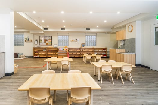 Spacious Montessori classroom with wooden furniture and learning materials at Balmain Road Montessori Academy childcare