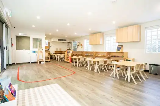 Spacious Montessori classroom with multiple learning stations at Balmain Road childcare centre
