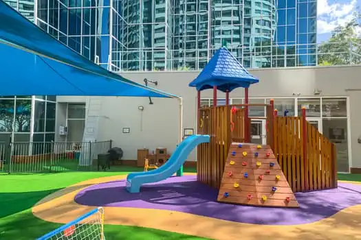 Chatswood childcare outdoor playground with climbing fort and slide