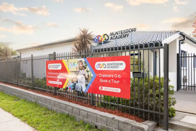 Montessori Academy Mount Annan childcare centre exterior with signage and secure fencing