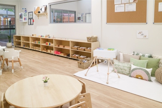 Montessori learning room at Revesby Montessori Academy with reading area and open shelves
