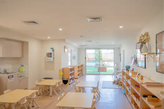 Montessori classroom at Winston Hills Montessori Academy featuring natural timber furniture and learning materials.