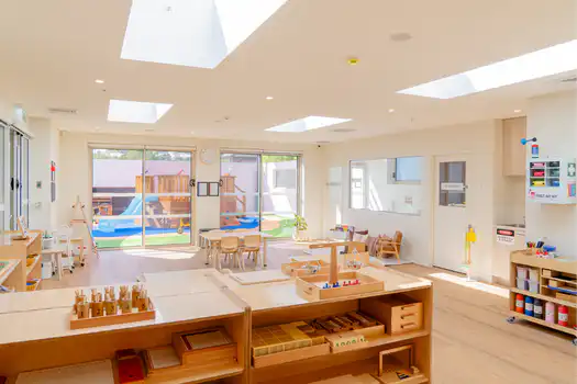 Preschool learning environment at Winston Hills Montessori Academy featuring open-plan Montessori classrooms and resources.
