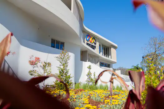 Winston Hills Montessori Academy exterior featuring landscaped gardens and welcoming childcare facilities.