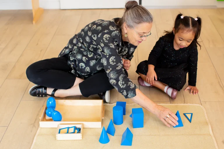 Child using Montessori geometry materials in a kindergarten program in Victoria