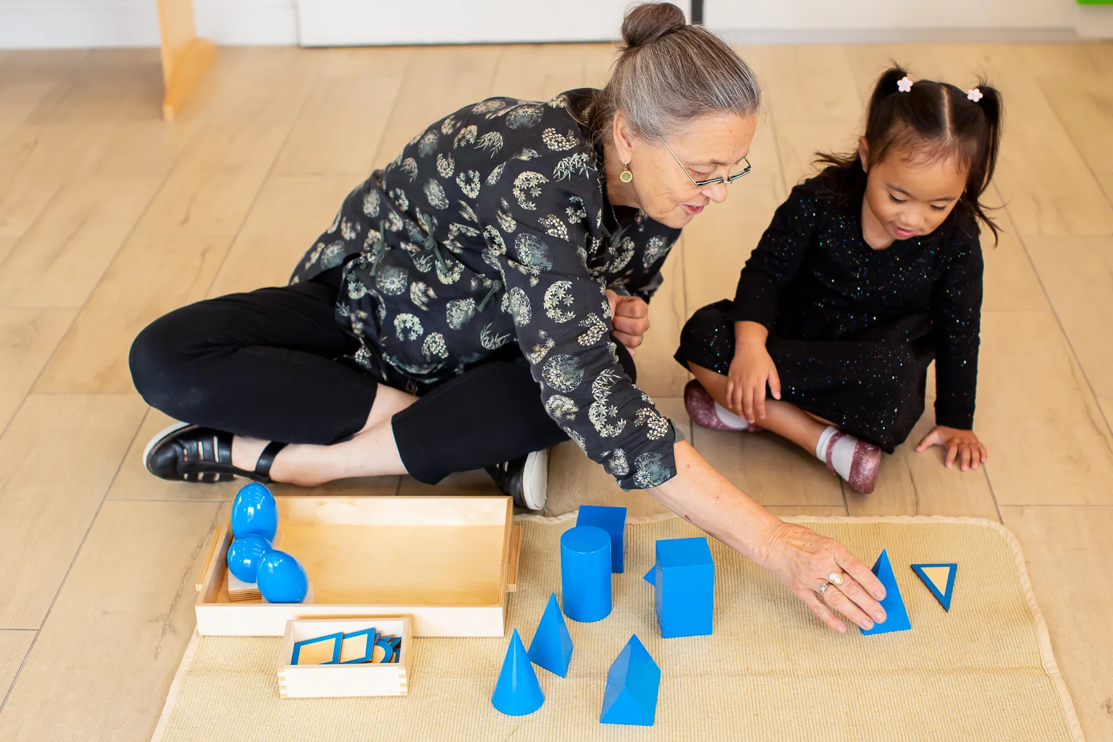 Child using Montessori geometry materials in a kindergarten program in Victoria