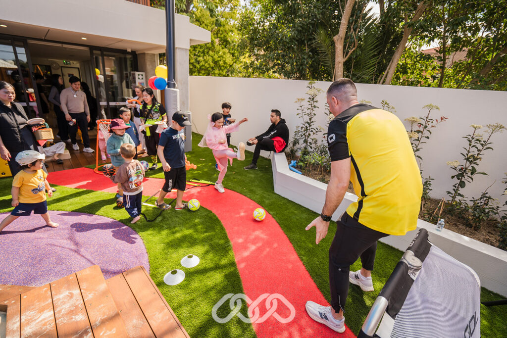 Children enjoying IFA sports activity outdoors at Bankstown North Montessori Academy