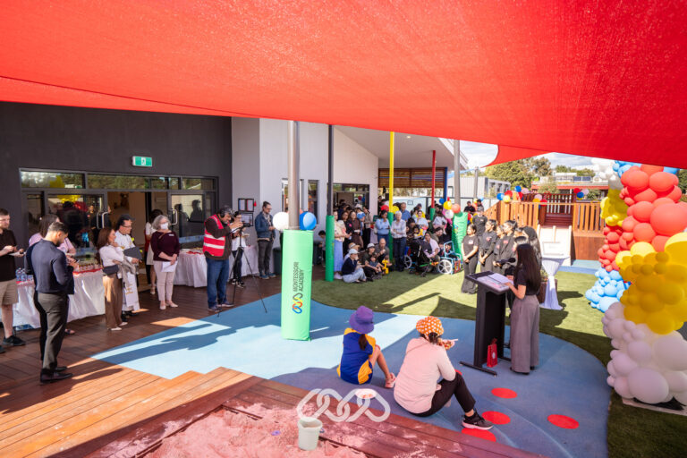 Families and children enjoying outdoor activities at the Heidelberg West Montessori Academy Grand Opening.