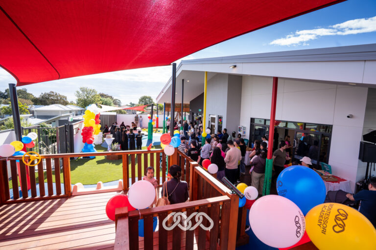 Children and families enjoying the outdoor play area at Heidelberg West Montessori Academy Grand Opening.